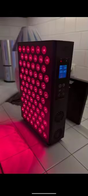 The Tabletop in a customer's kitchen, on the floor with the kickstand deployed, control panel display visible, LEDs glowing red