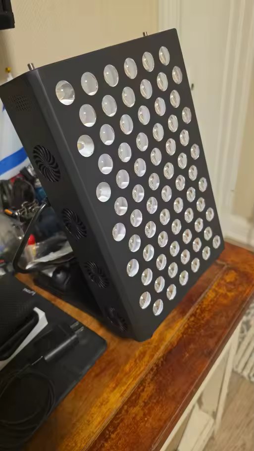 The Tabletop on a wooden side table in a living room, in standby mode